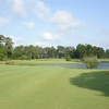 A view of green surrounded by water at Mississippi National Golf Club
